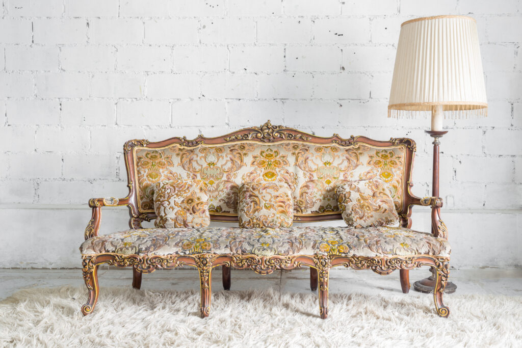 Original Classical style Armchair sofa couch in vintage room with desk lamp