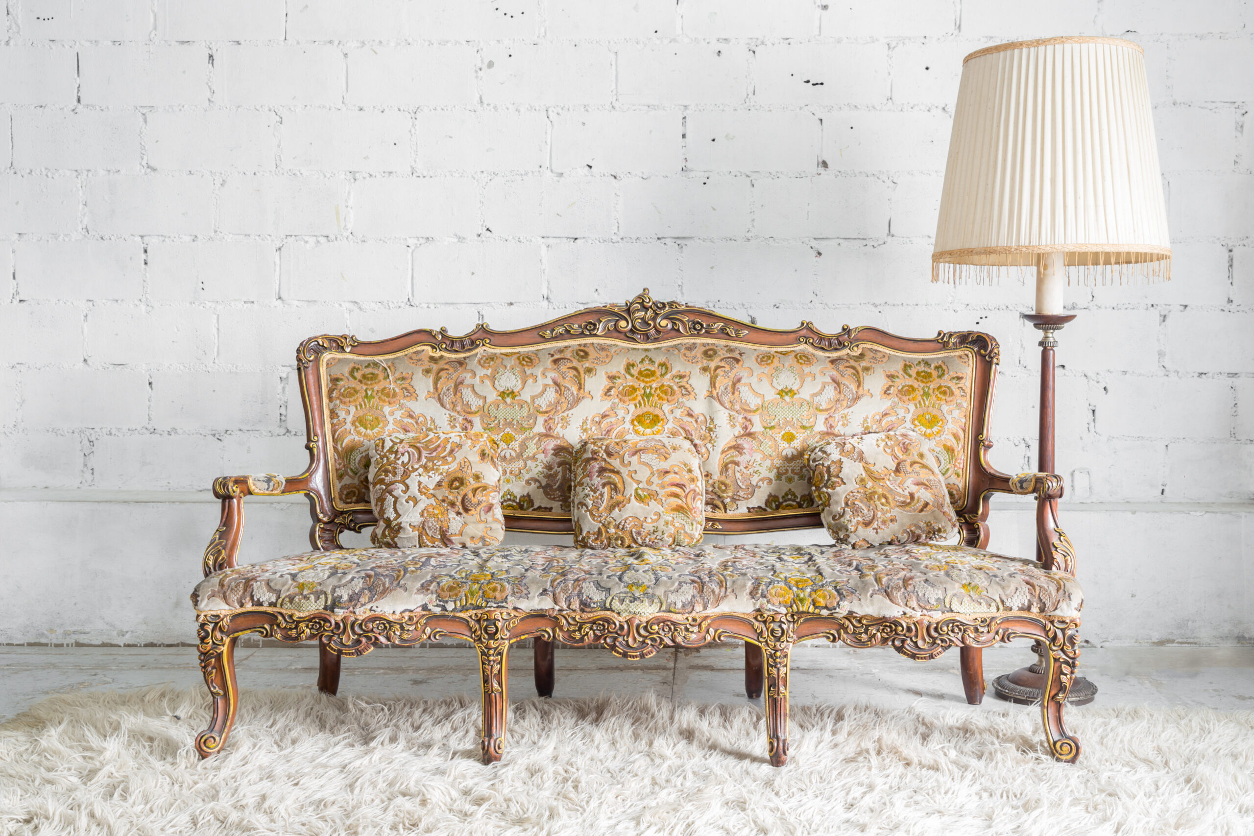 Original Classical style Armchair sofa couch in vintage room with desk lamp